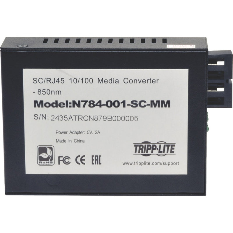 Detail view of Tripp Lite media converter showing product documentation and certification marks