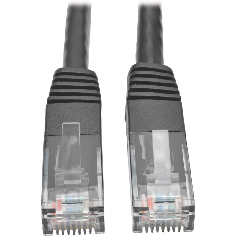 Close-up view of two transparent RJ45 connectors with gold-plated contacts and black strain relief boots on a Cat6 network cable