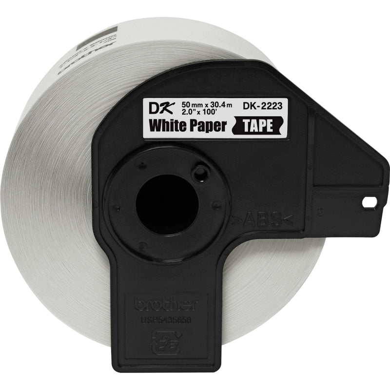 Close-up view of Brother DK2223 white paper label roll showing spool design and product specifications