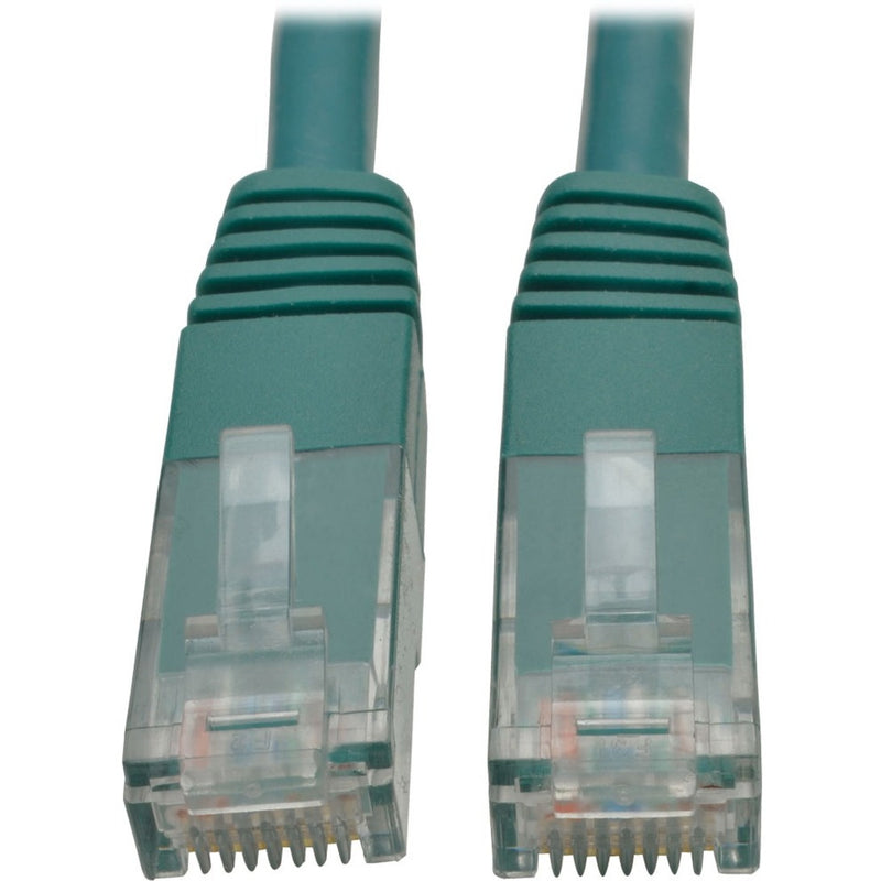 Close-up view of green Cat6 ethernet cable RJ45 connectors with transparent housing and gold contacts