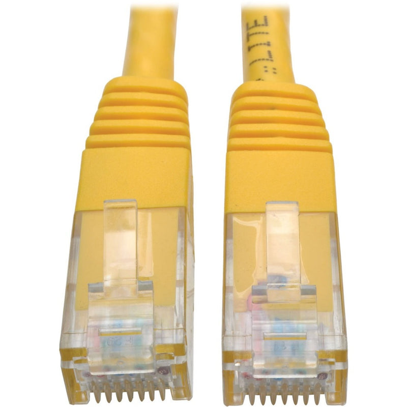 Close-up view of two yellow Cat6 RJ45 connectors with gold-plated contacts and strain relief