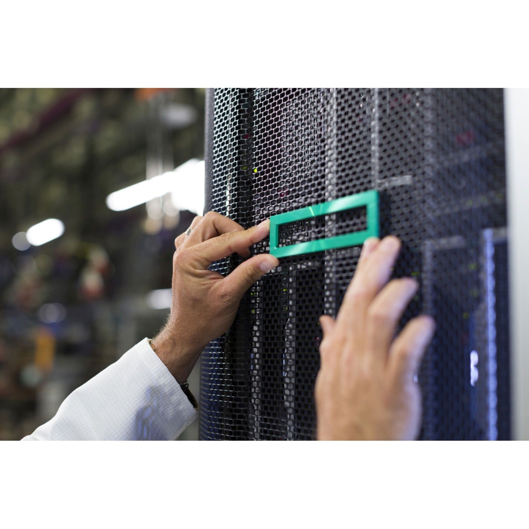 IT professional installing HPE Gen10 2U Bezel Kit on server rack with security lock feature visible-alternate-image1