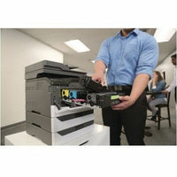 Technician accessing internal components of Lexmark printer with installed paper tray-alternate-image4