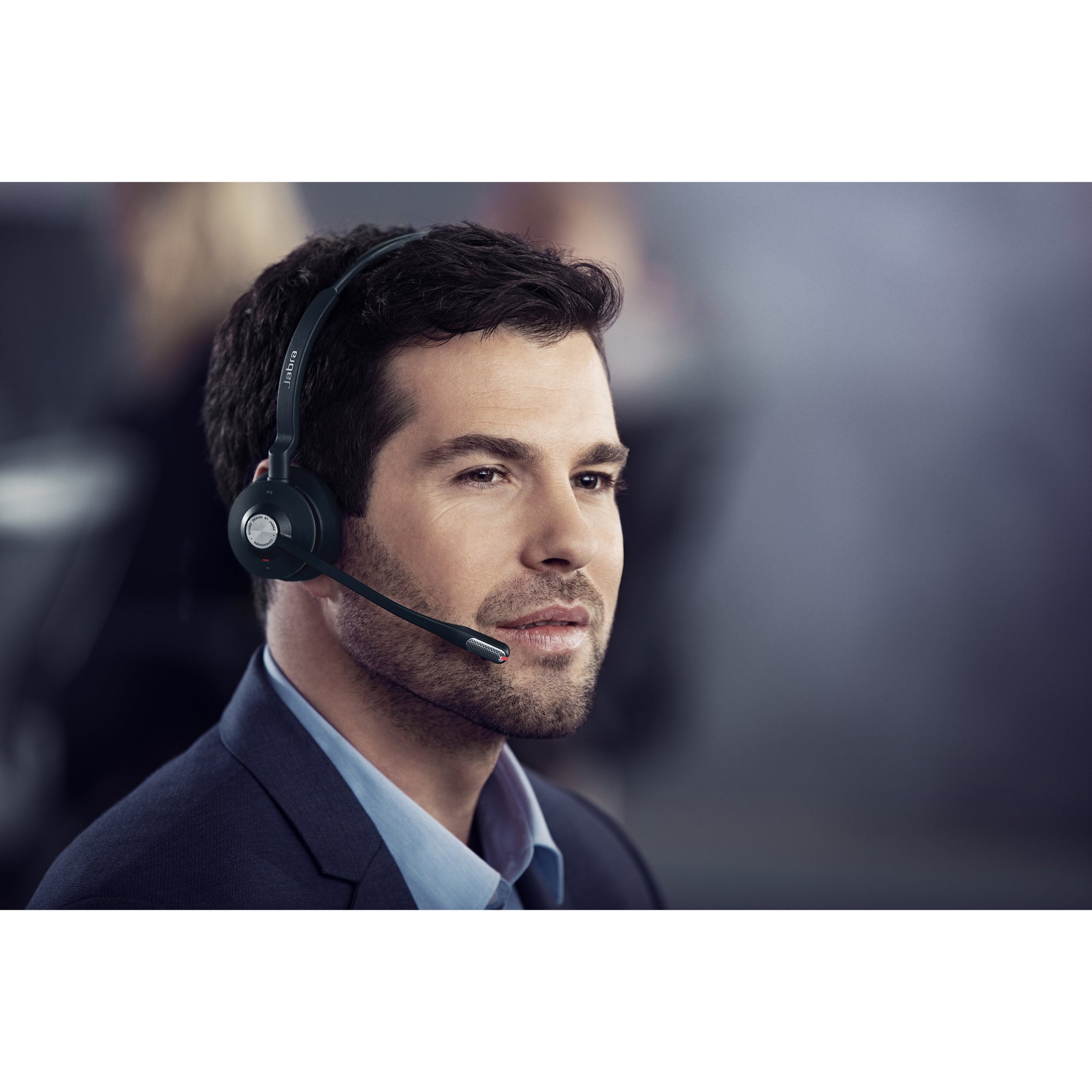 Professional actively using Jabra Engage 75 headset in dynamic work setting-alternate-image15