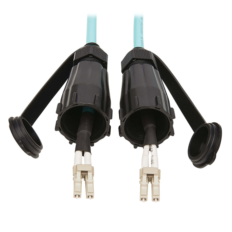 Detailed view of industrial fiber cable connectors with protective housing and dust caps