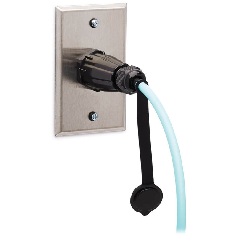 Industrial fiber optic cable mounted on stainless steel wall plate with protective housing