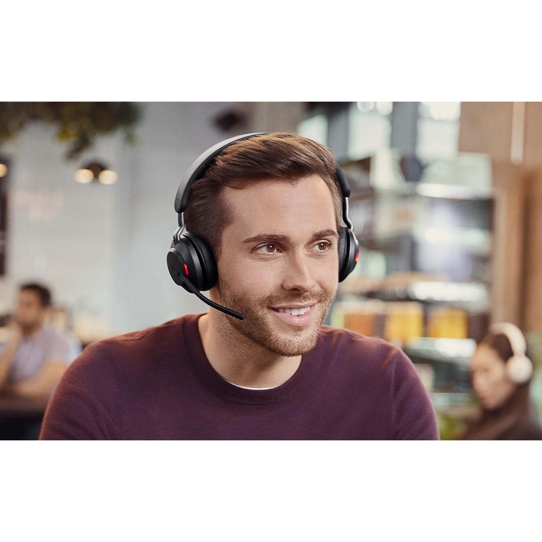 Professional engaged in conversation wearing Jabra Evolve2 65 headset-alternate-image11