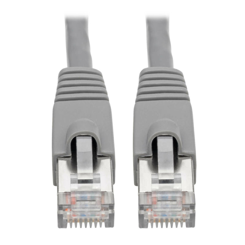 Close-up view of shielded RJ45 connectors with gold-plated contacts and snagless boots on Cat6a cable