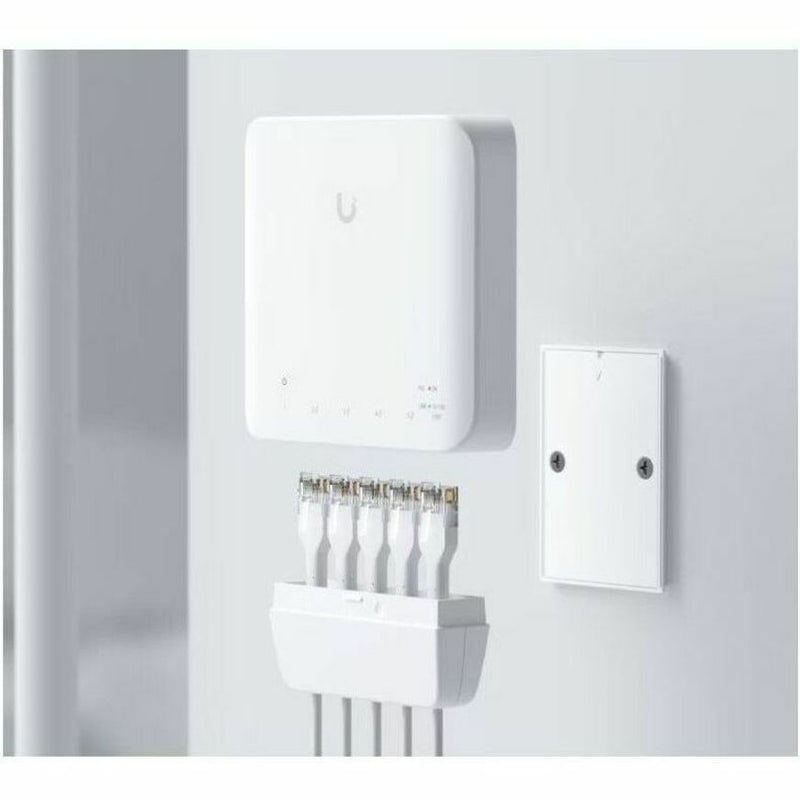 UniFi Switch Flex showing cable management system and mounting plate installation