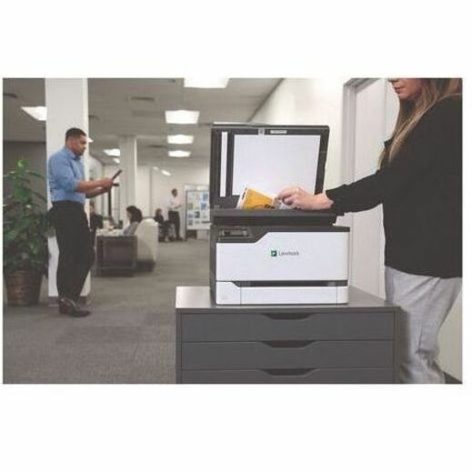 Business professionals using Lexmark printer in an office setting