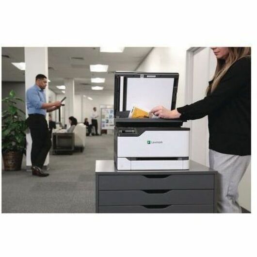 Business professionals using Lexmark printer in active office environment