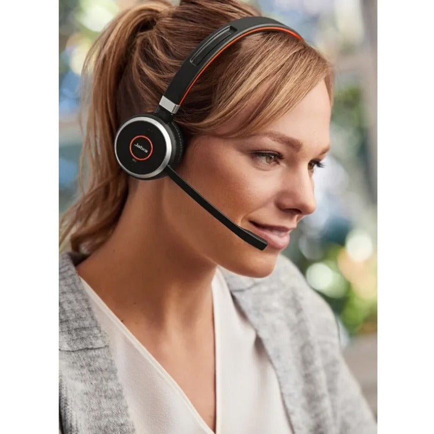 Professional wearing Jabra Evolve 65 SE headset in office environment-alternate-image4