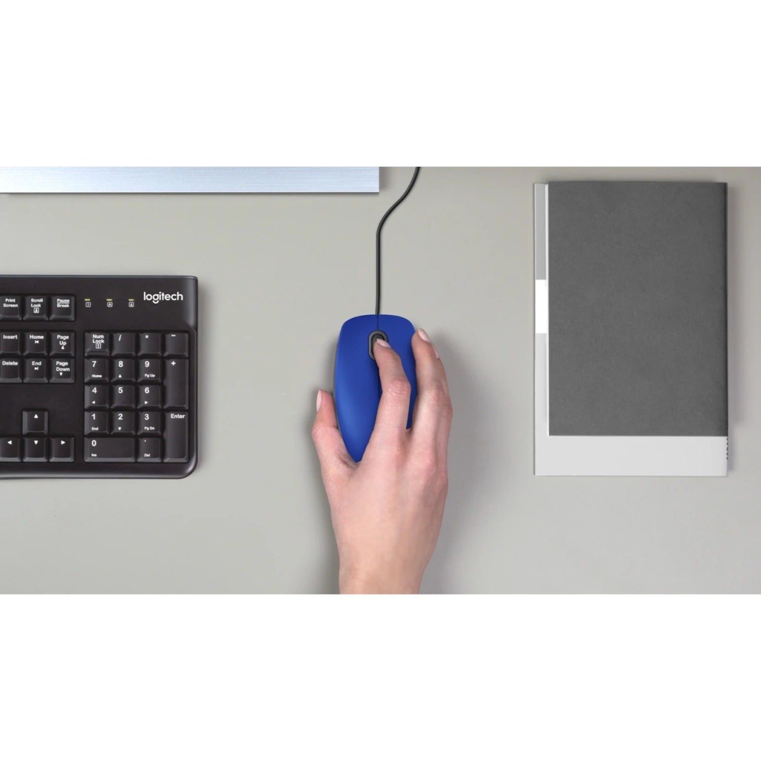 Logitech M110 Silent mouse shown in use on a desk with keyboard and notebook-alternate-image6