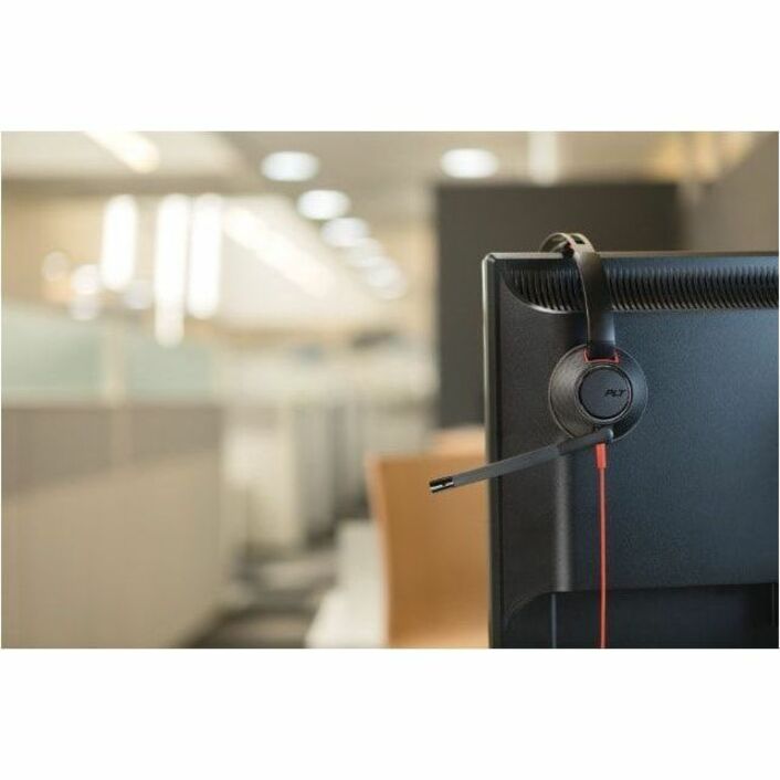 Poly Blackwire 5220 headset mounted on office monitor in professional workspace setting-alternate-image2