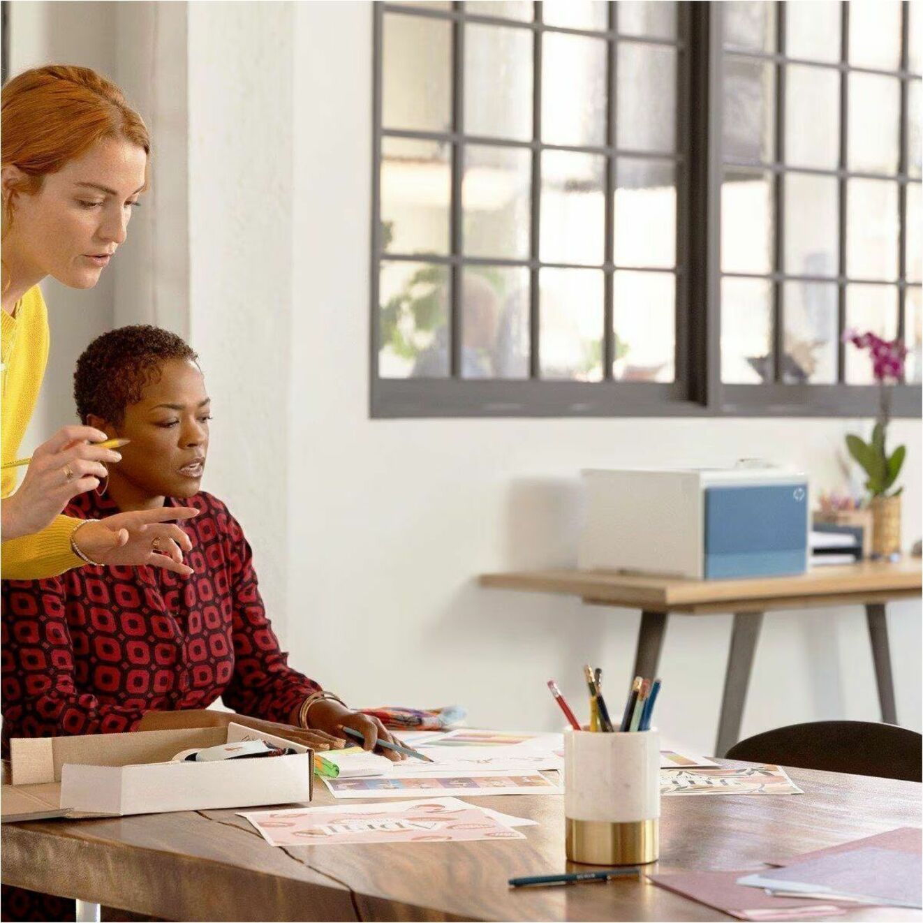 Office setting showing team members collaborating near the HP Color LaserJet Pro 4201dn printer-alternate-image6