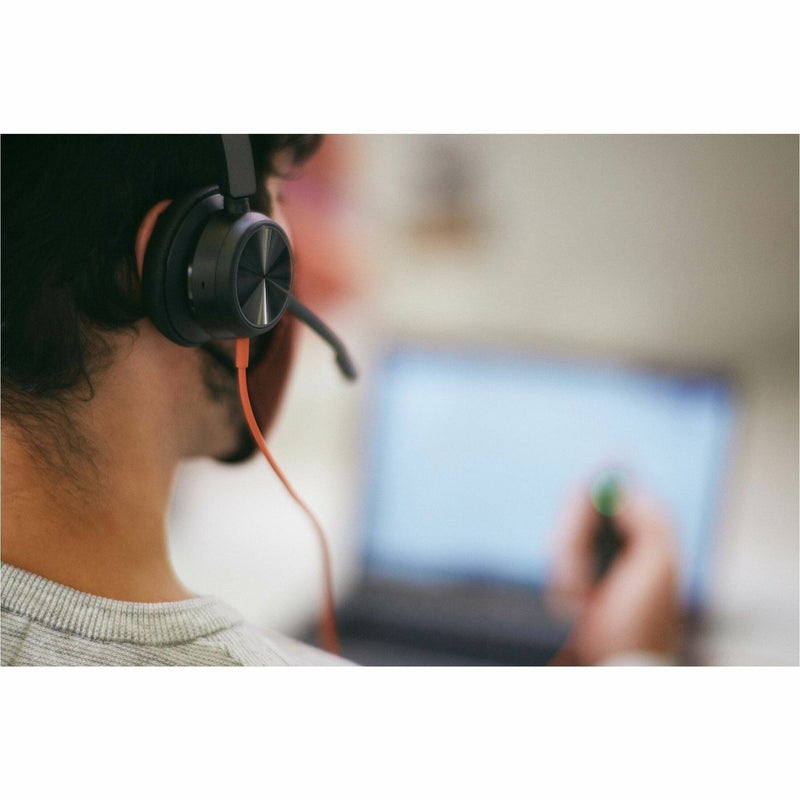 Close-up of Poly Blackwire headset during focused work session