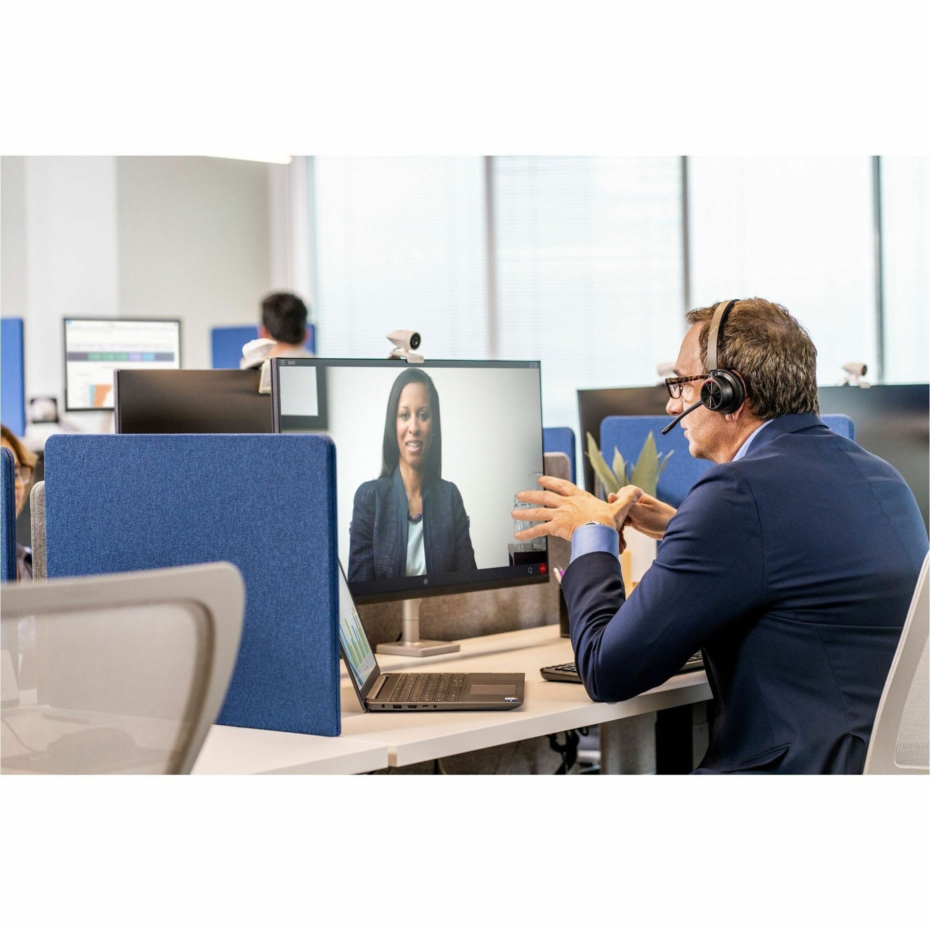 Person using Poly Voyager 4320-M headset during video conference-alternate-image9