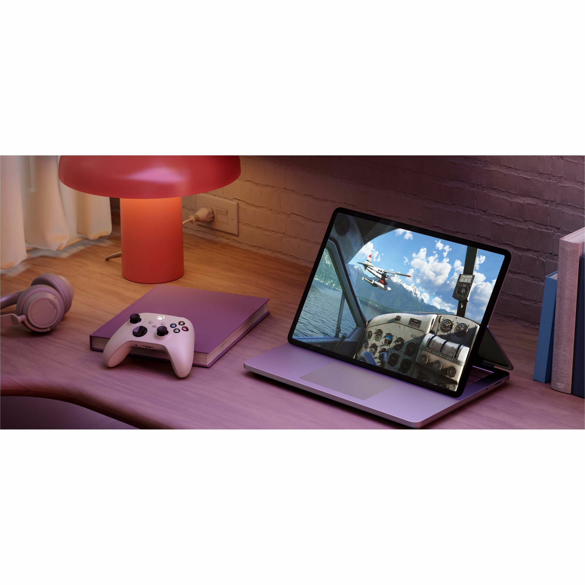 Surface Laptop Studio 2 in entertainment setup with gaming controller-alternate-image15