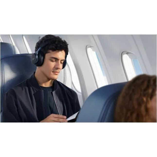 Person wearing Space One headphones while traveling on an airplane-alternate-image10