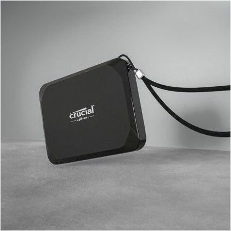 Crucial X9 SSD with lanyard attachment showing portability features