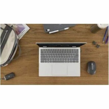 Overhead view of desk setup with laptop and MX Anywhere 3S mouse-alternate-image11