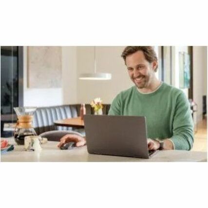 Person using MX Anywhere 3S mouse with laptop in home office setting-alternate-image10