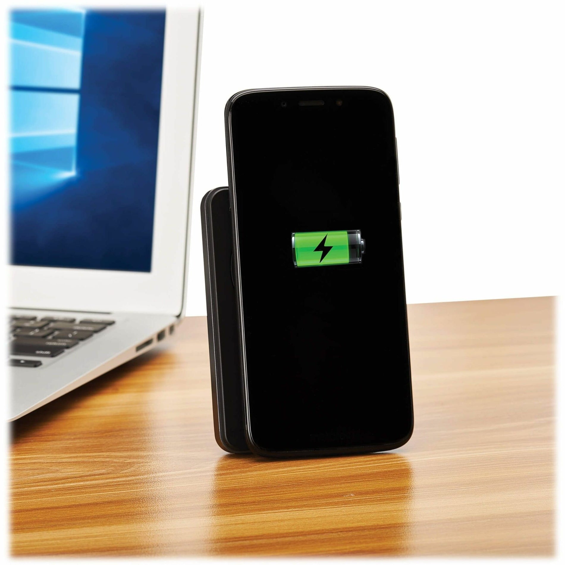 Power bank charging smartphone on desk with laptop in background-alternate-image14