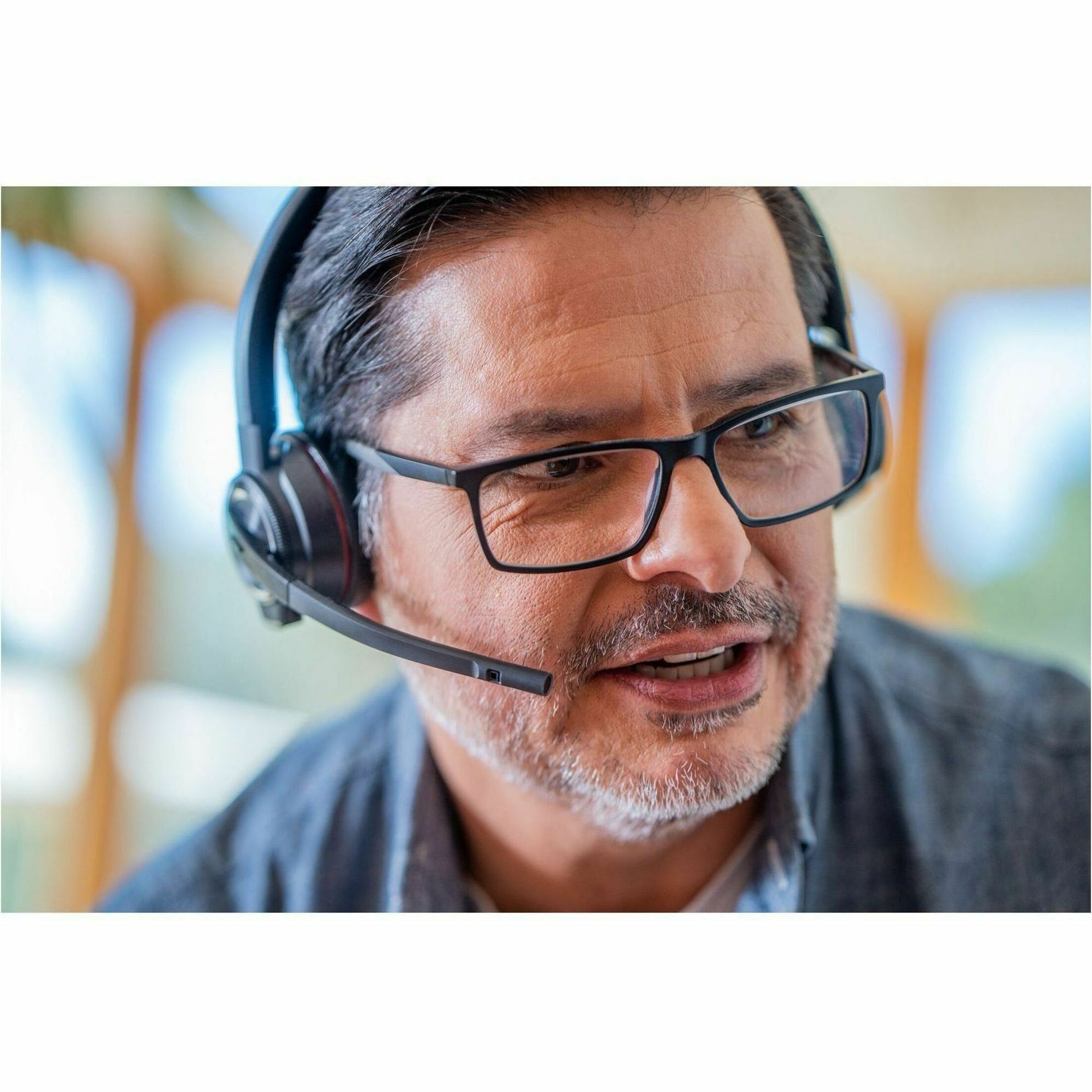 Professional wearing Poly Savi 8220 headset during work conversation-alternate-image7