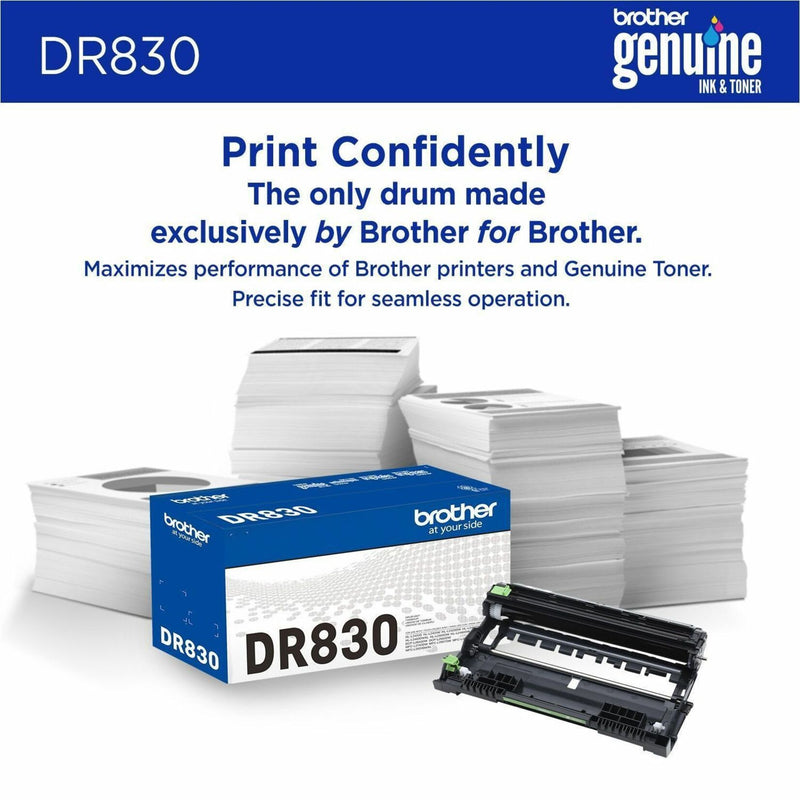 Brother DR830 drum unit with product packaging and stacks of paper