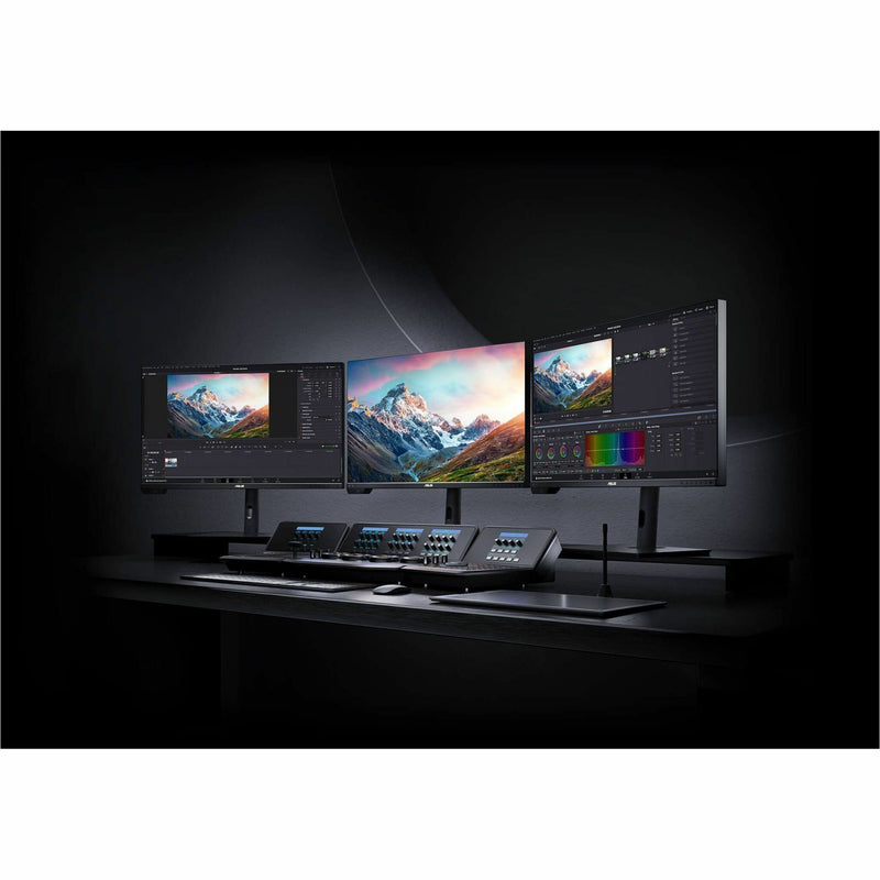 Professional editing setup with multiple ASUS ProArt displays and control surfaces