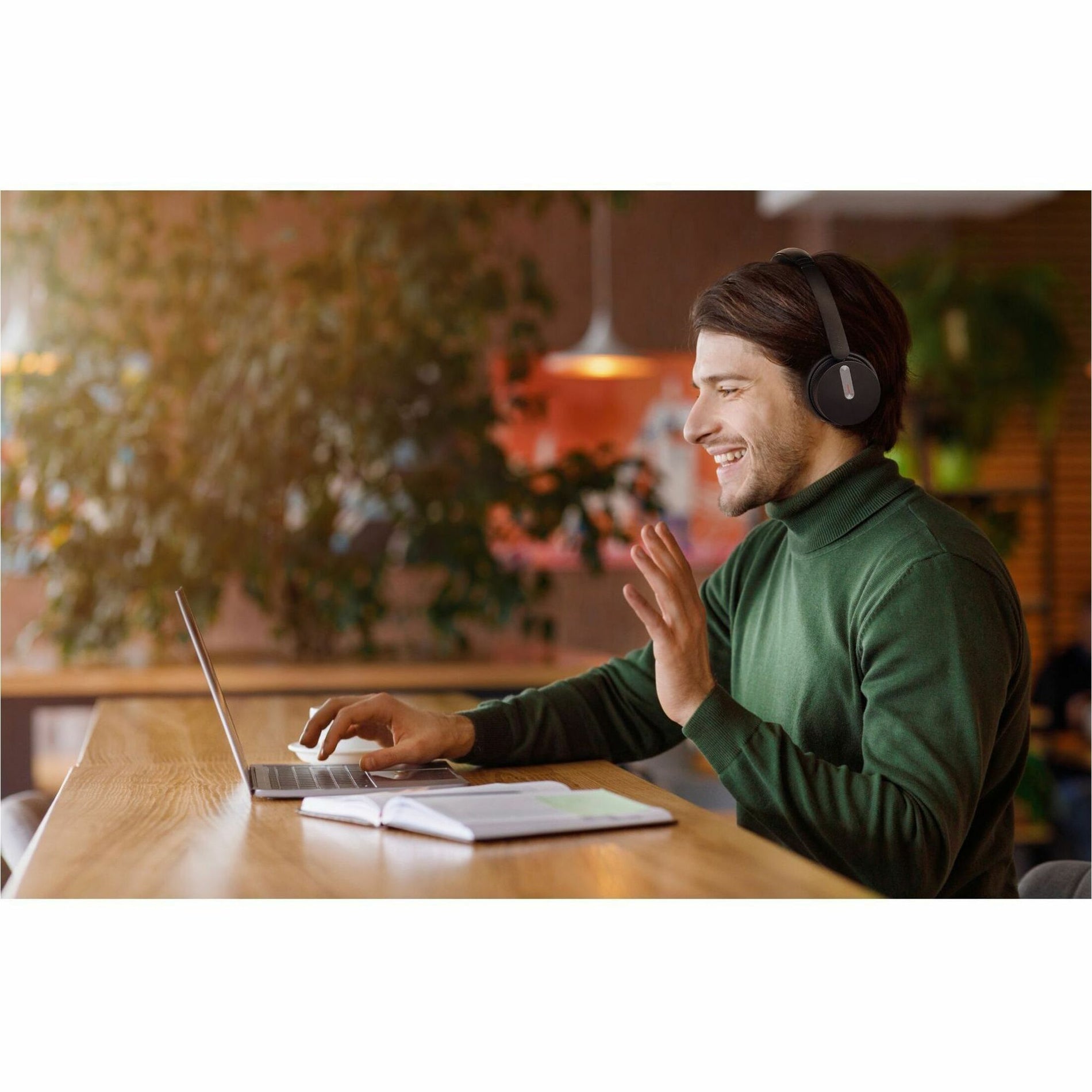 Professional using Yealink BH70 headset during video conference in home office setting-alternate-image6