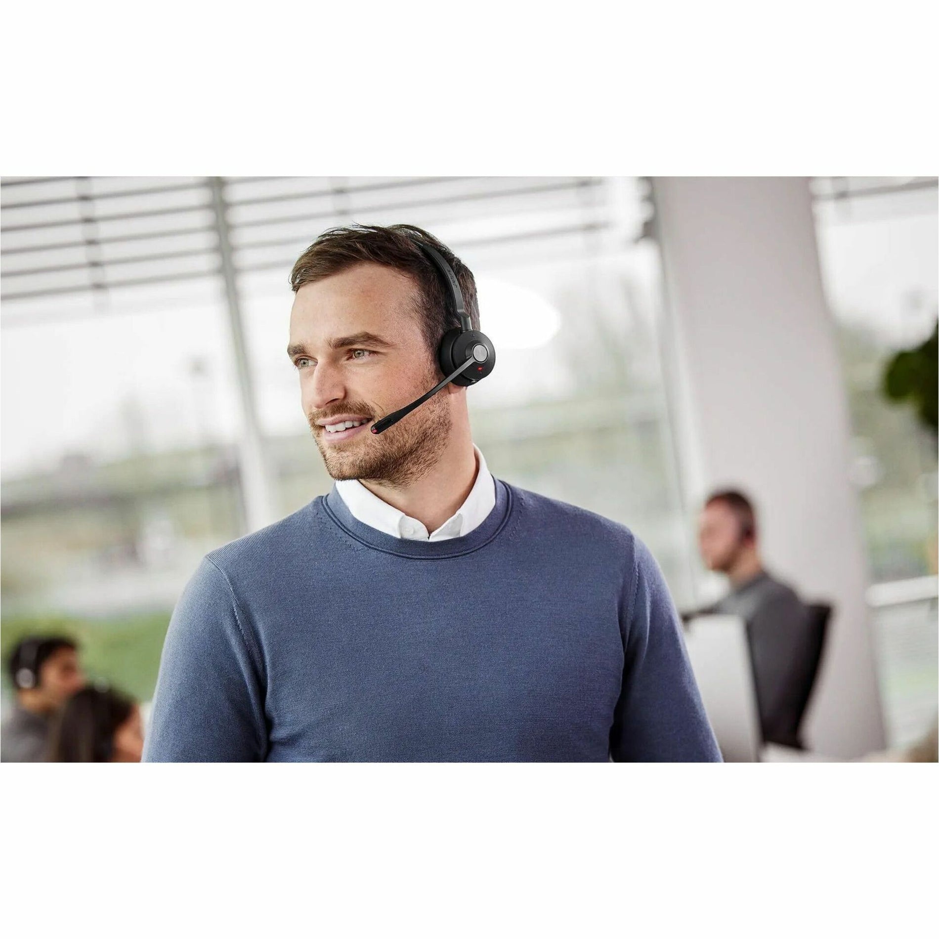 Professional actively engaging in conversation while wearing Jabra Engage 55 headset-alternate-image6