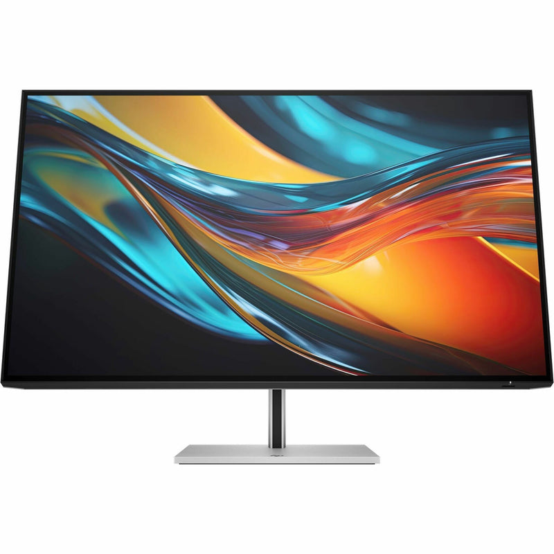 Front view of HP 7 Pro 31.5-inch 4K monitor displaying vibrant colors with turquoise and orange waves, showcasing IPS Black technology and wide color gamut