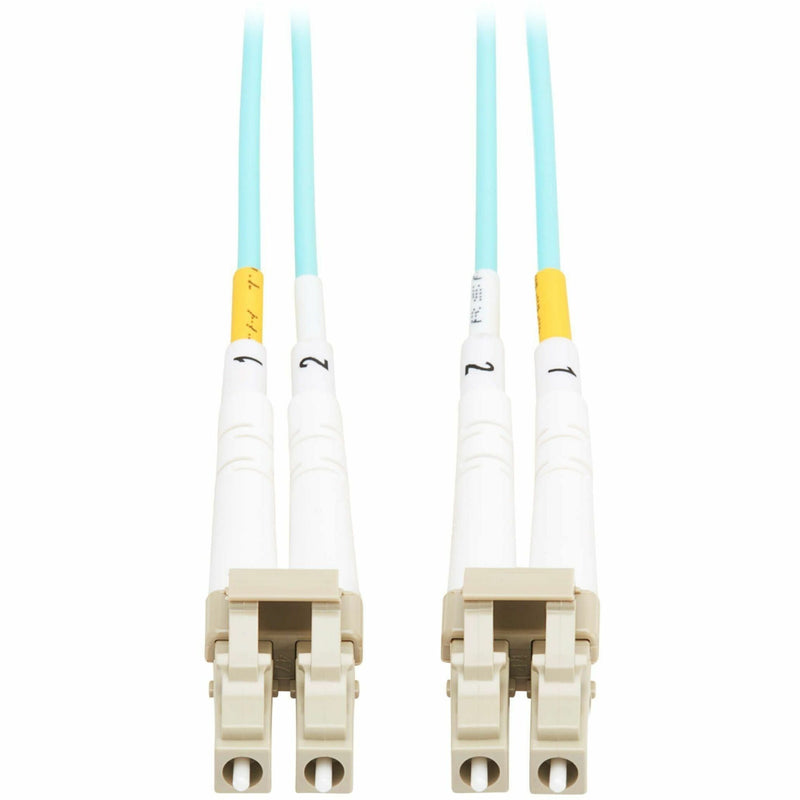 Close-up view of white LC fiber connectors with yellow strain relief boots