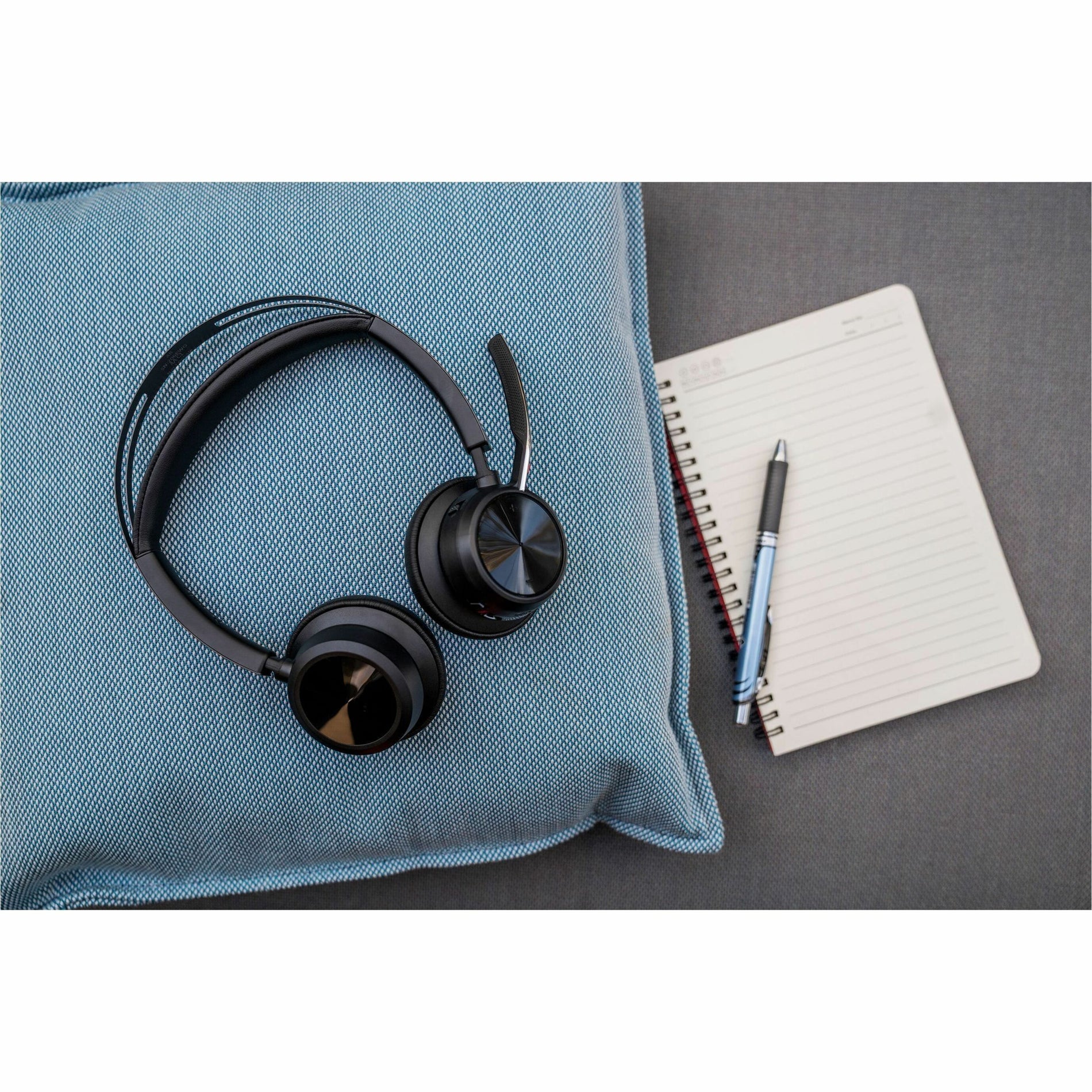 Poly Voyager Focus 2 headset displayed with notebook and accessories-alternate-image7