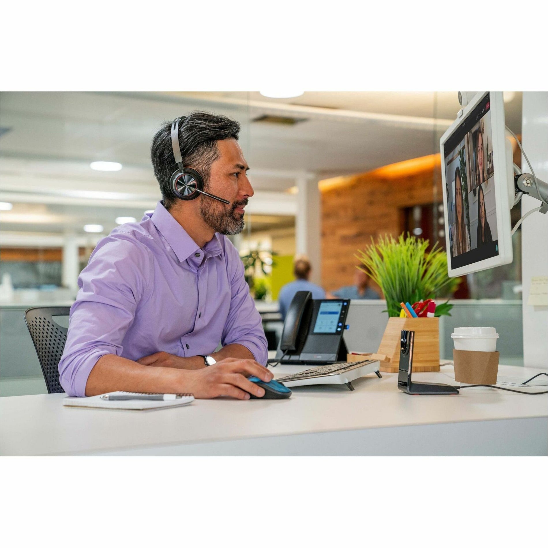 Poly Voyager Focus 2 headset in use during video conference-alternate-image10