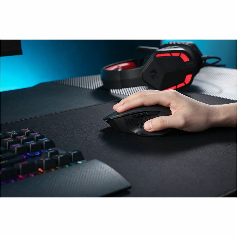 Redragon M656 gaming mouse on desk with RGB keyboard and gaming headset