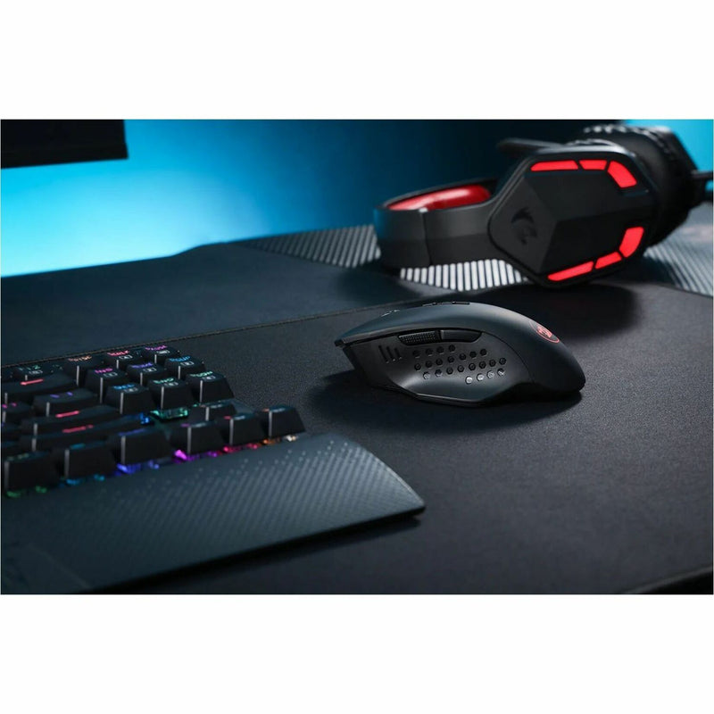 Redragon M656 gaming mouse with RGB keyboard in gaming setup environment