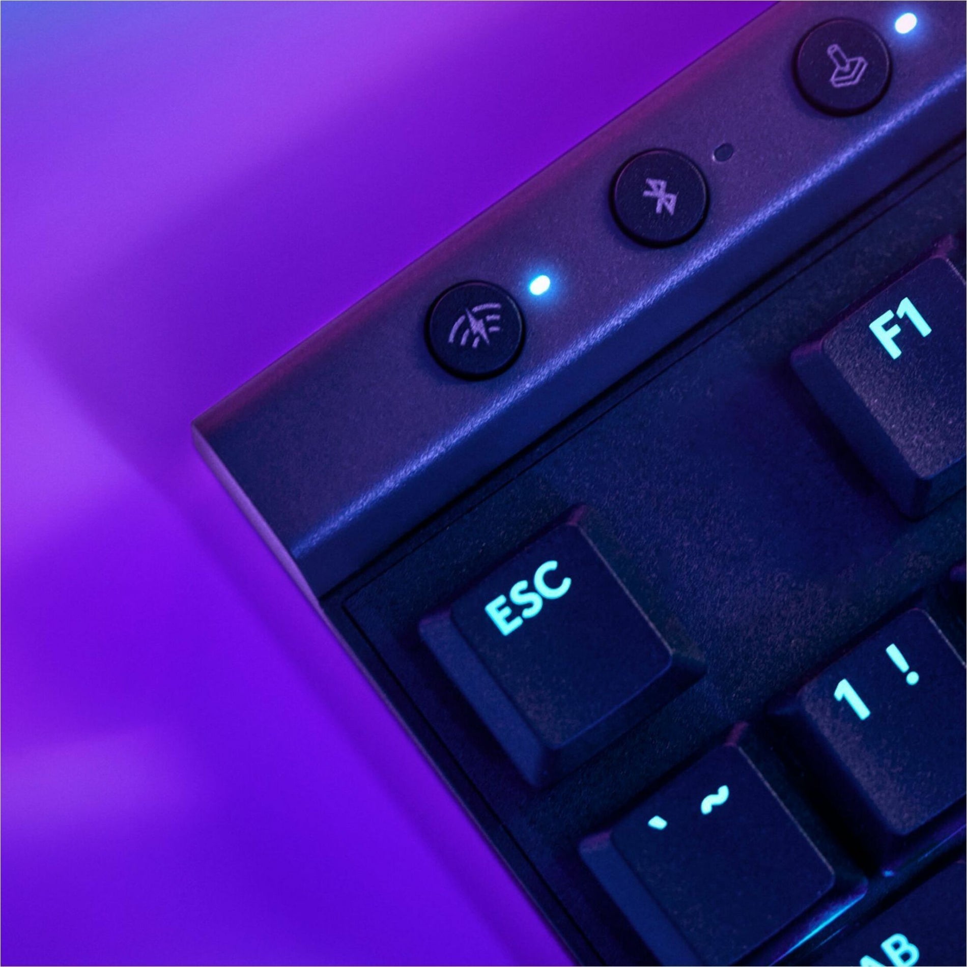 Close-up of G515 keyboard control buttons with LED indicators in purple lighting-alternate-image3