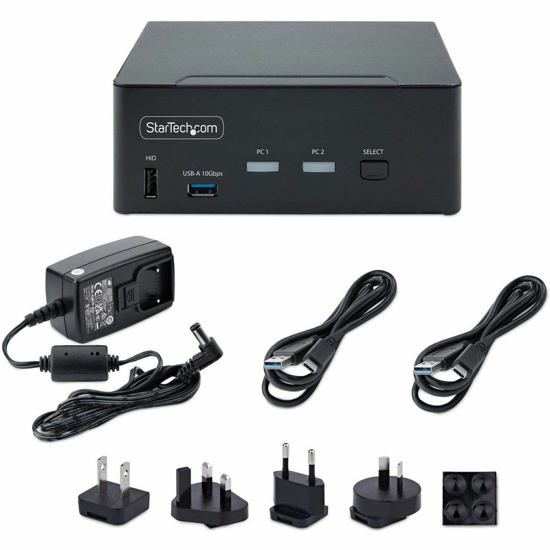 KVM switch with included accessories, power adapters, and cables