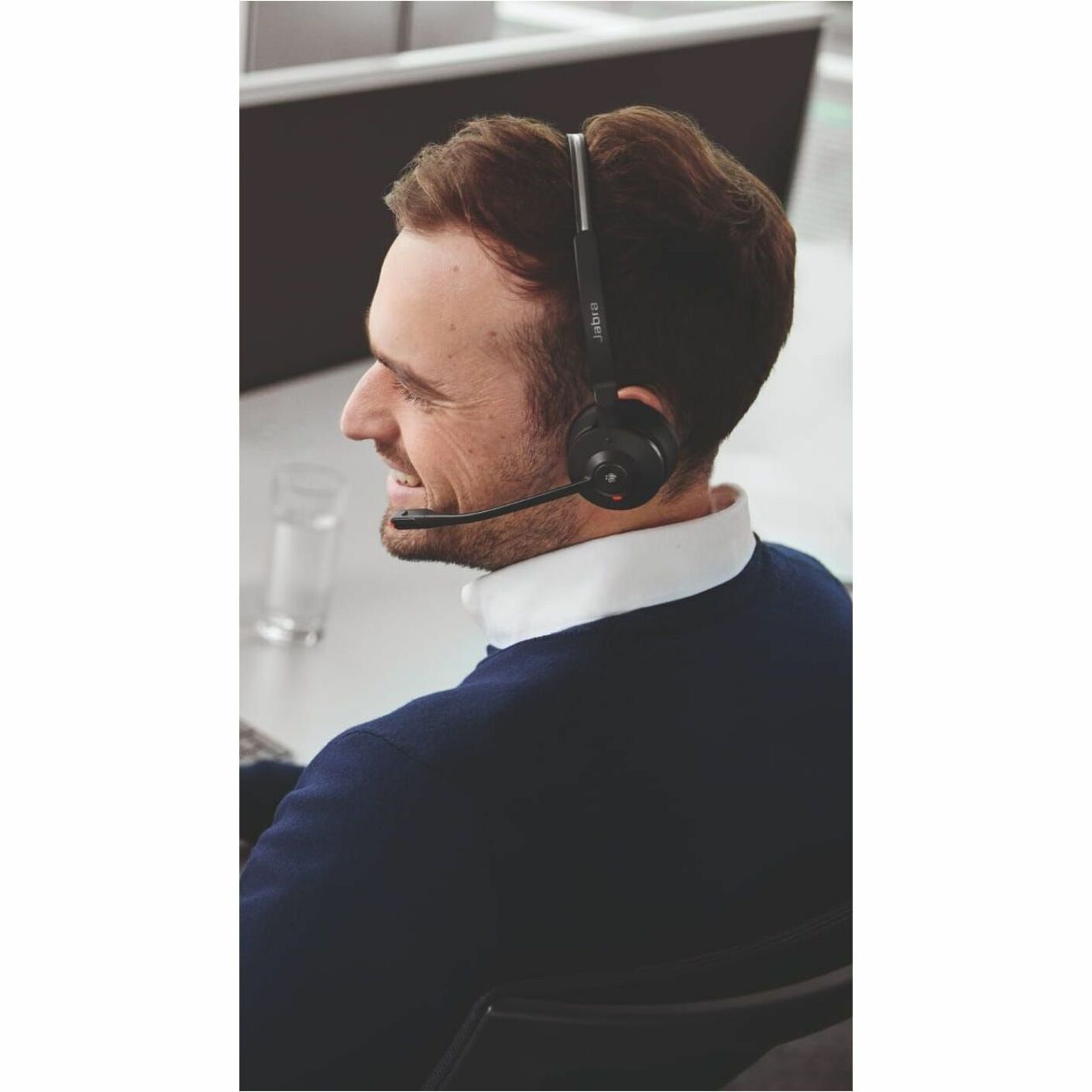 Professional wearing Jabra Engage 55 SE headset in office environment-alternate-image3