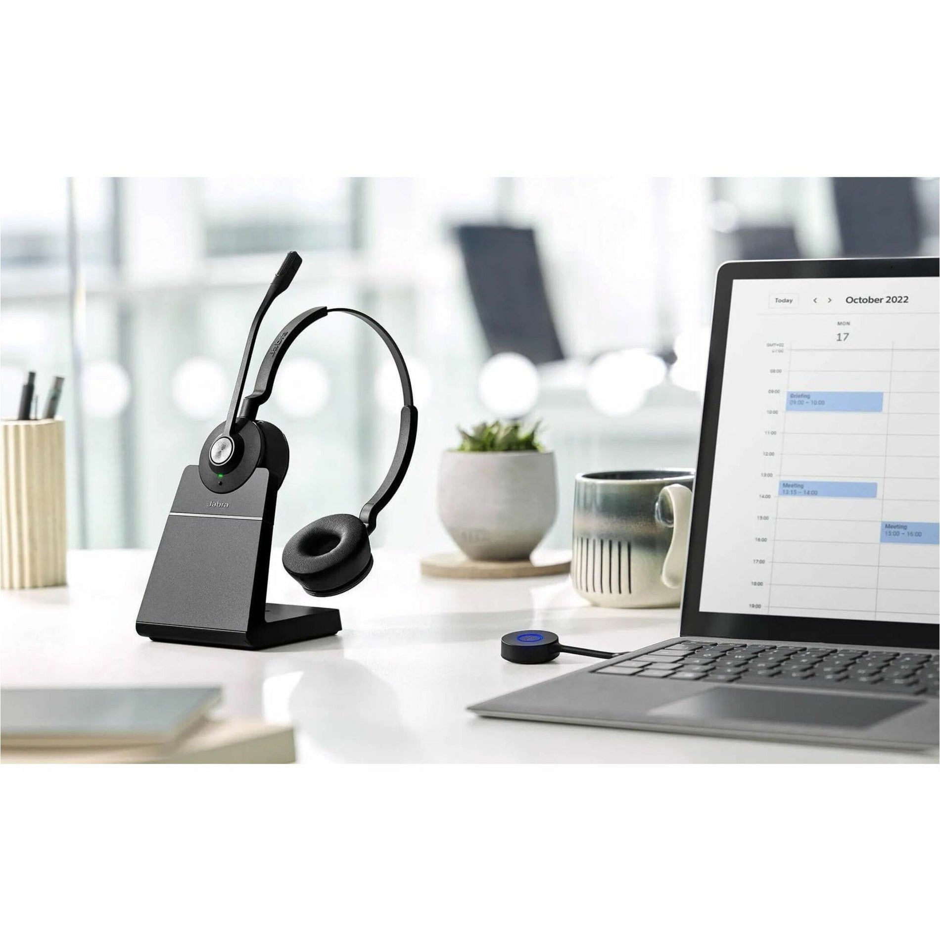 Jabra Engage 55 SE headset with charging stand in modern office setting-alternate-image4