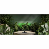 MSI PRO MP245G monitor in natural setting with green background-alternate-image12