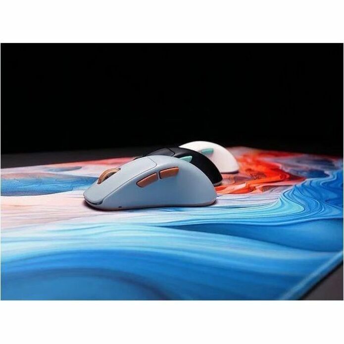 Multiple CHERRY XTRFY M64 mice in different colors on artistic background-alternate-image8