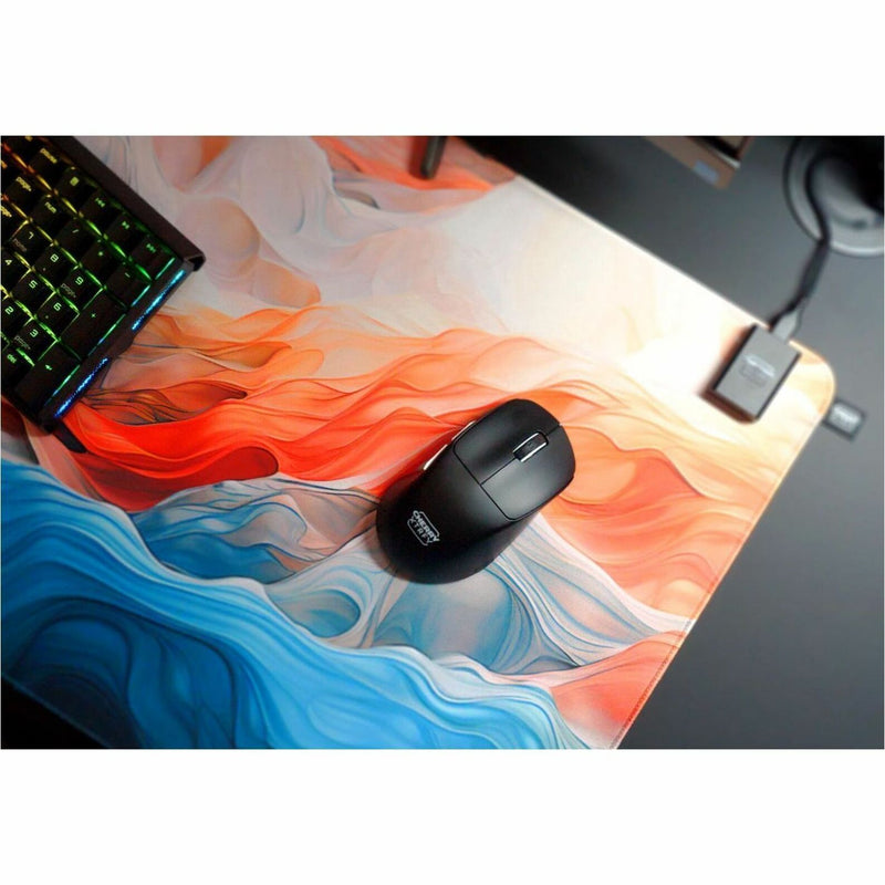 CHERRY XTRFY M64 Pro Wireless gaming mouse in gaming setup with RGB keyboard and mousepad