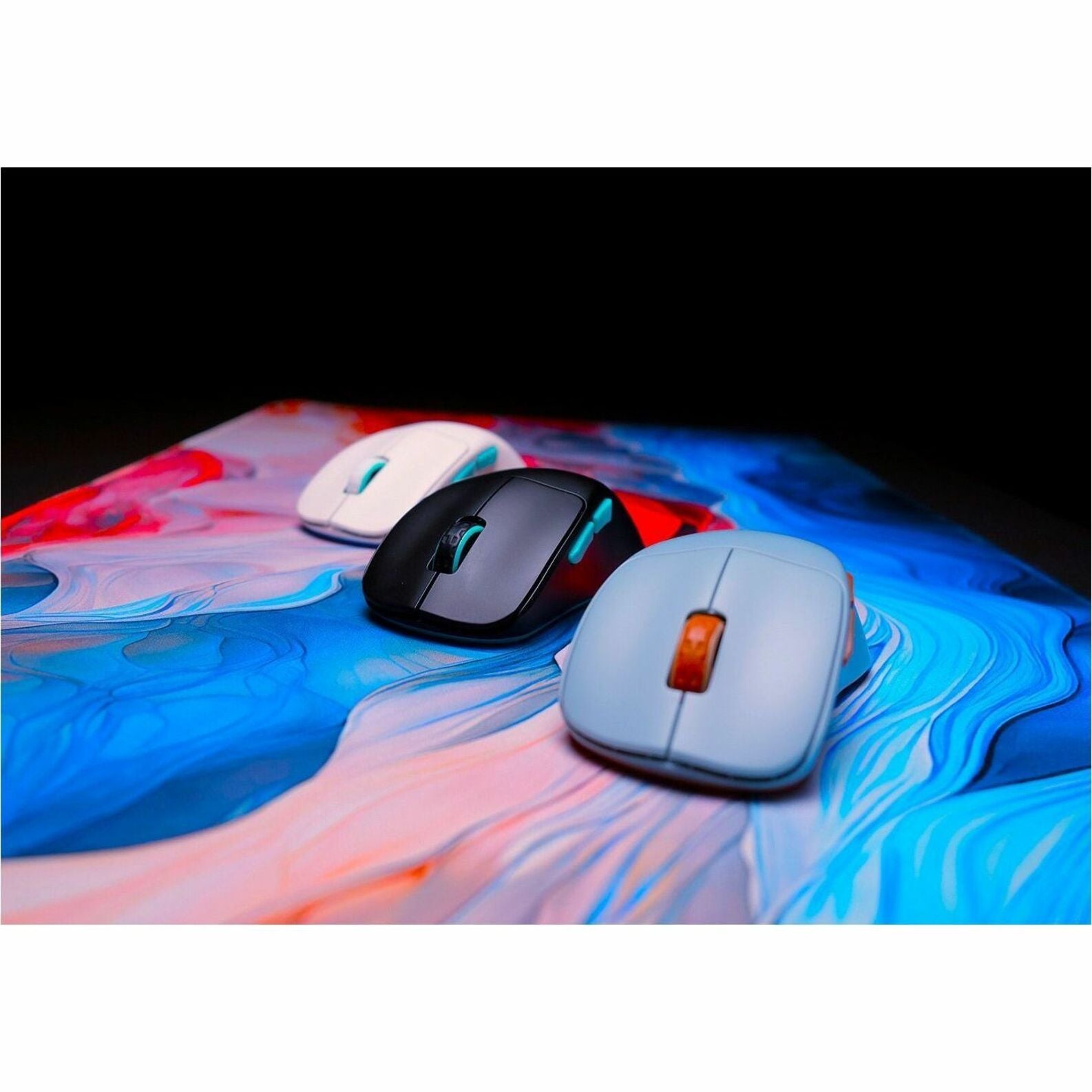 Multiple CHERRY XTRFY M64 mice in different colors on artistic background-alternate-image5