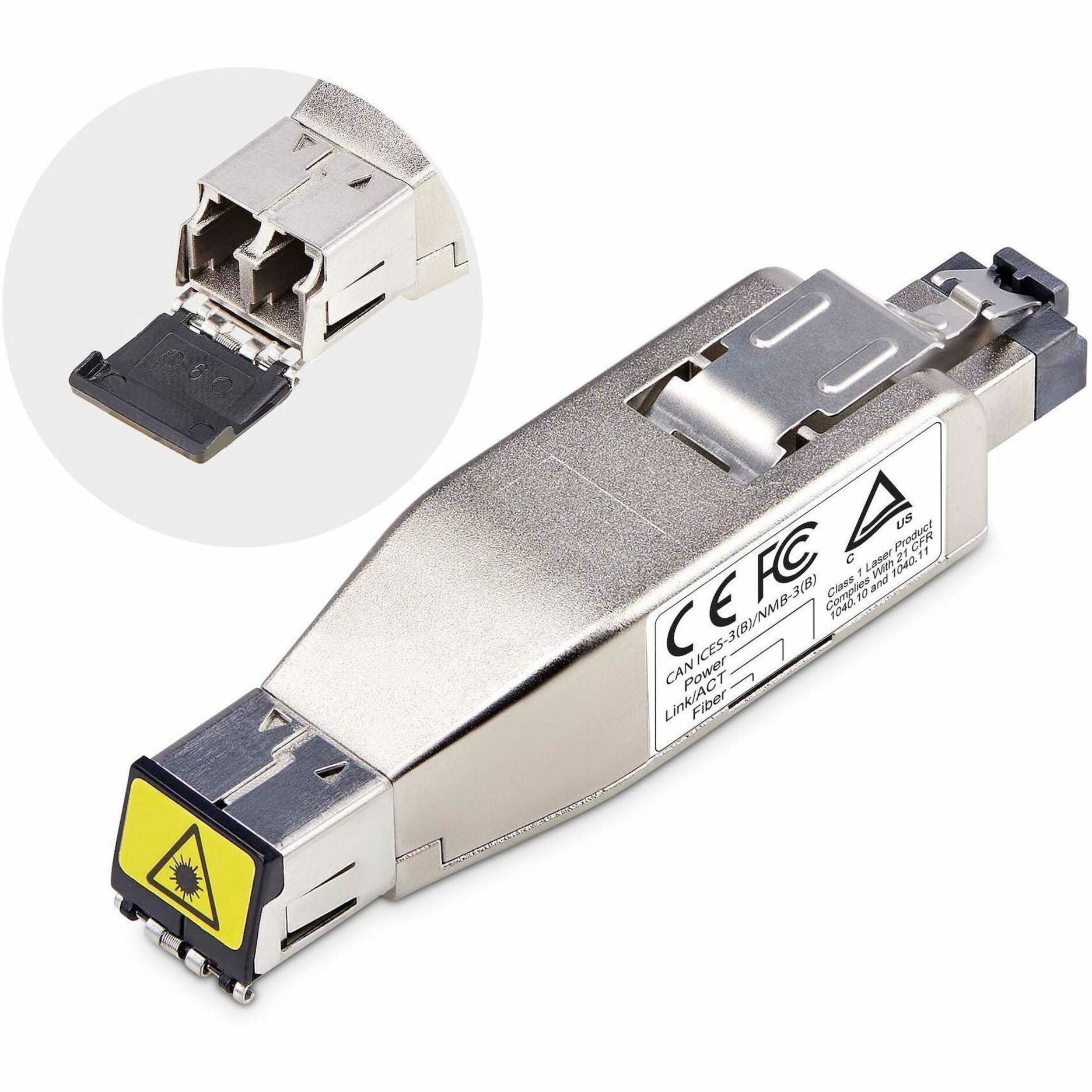 Close-up view of StarTech.com fiber media converter showing RJ45 and LC fiber ports with regulatory compliance labels-alternate-image1