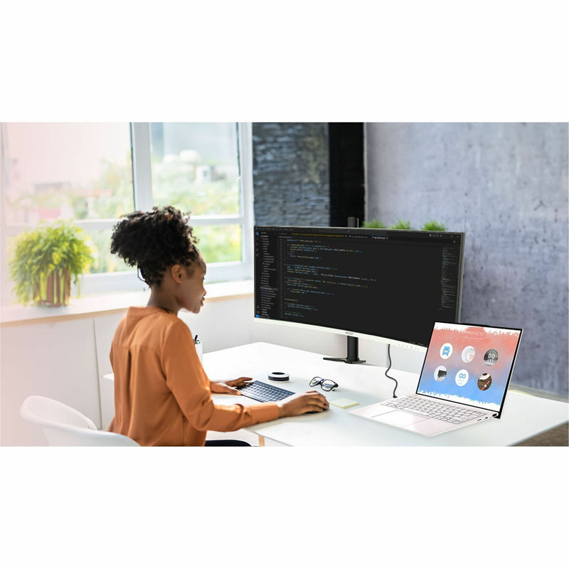 Person working with MSI Modern MD342CQPW in office setting