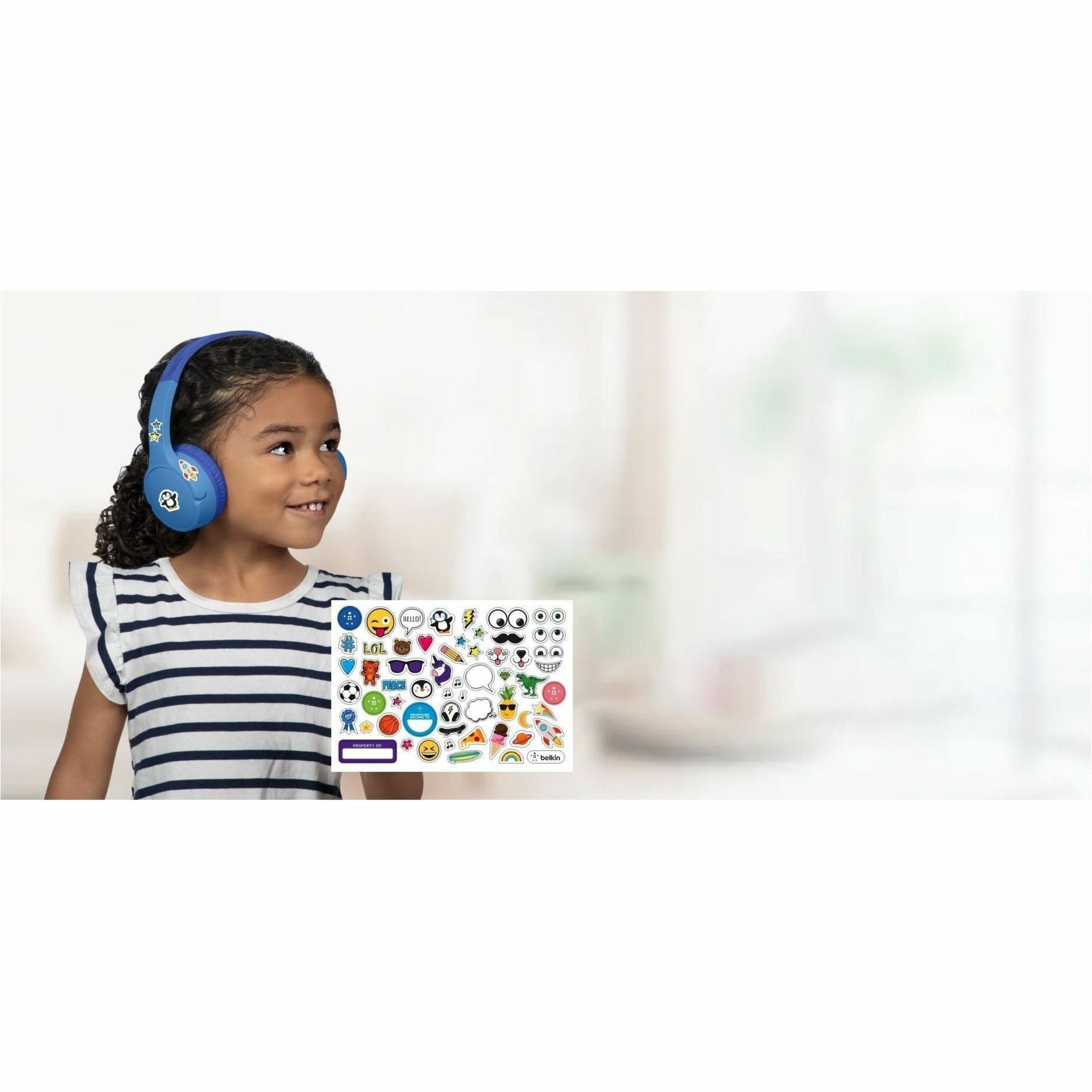 Young child wearing blue Belkin SoundForm Mini headphones with decorative stickers display-alternate-image6