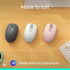 Three Logitech M196 mice in different colors displayed on wooden surface-alternate-image4